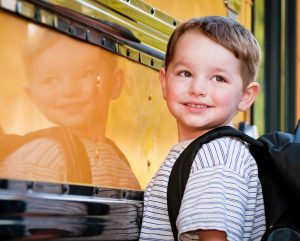 Kindergarten boy waiting for bus